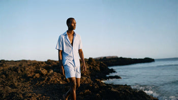a man walking in rundle clothing 