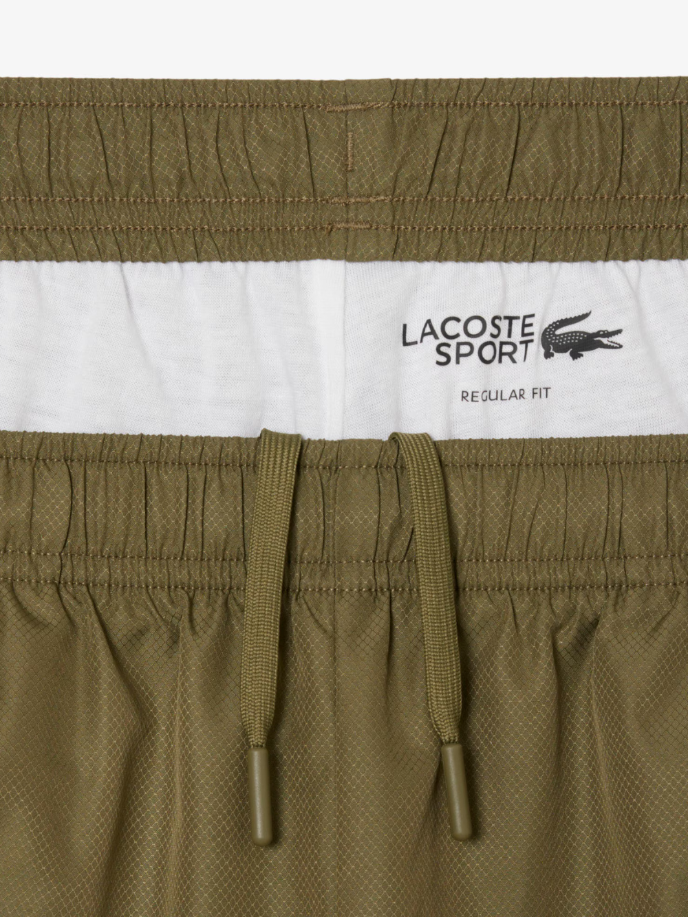 LACOSTE Diamond Taffeta Sport Tracksuit in Khaki Green - model wearing complete set showcasing athletic performance and style
